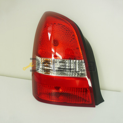 Фонарь задний левый для Ниссан Примера Р12 седан оригинал
